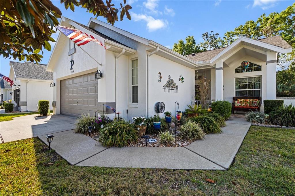 3569 South Belgrave Drive Inverness, FL 34452 - Photo 4 of 70 a front view of a house with garden