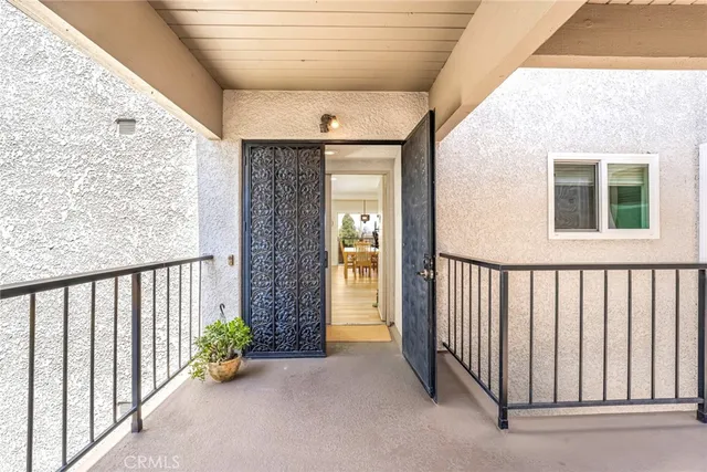a view of a porch with wooden floor