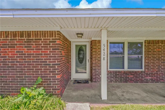 a view of a brick house with a window