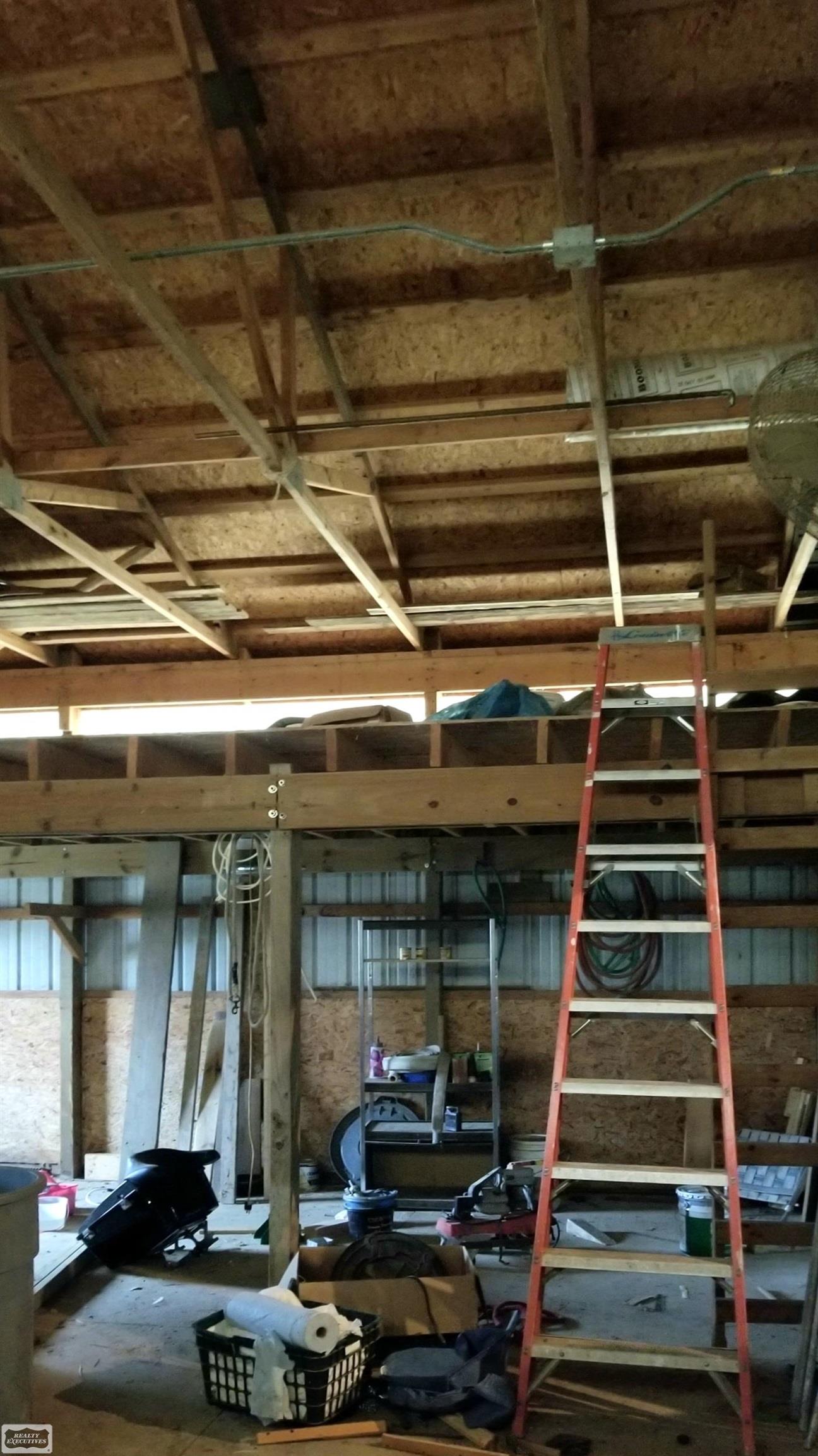 75575 Romeo Plank Road Armada, MI 48005 - Photo 12 of 64 Backside interior of pole barn was once used as horse stables. Additional storage above.