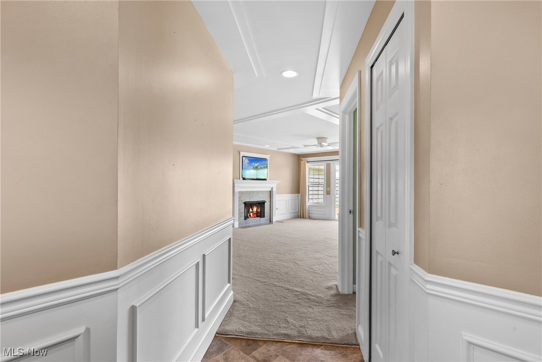 5215 River Road Madison, OH 44057 - Photo 14 of 36 Corridor featuring carpet floors, recessed lighting, and a wainscoted wall