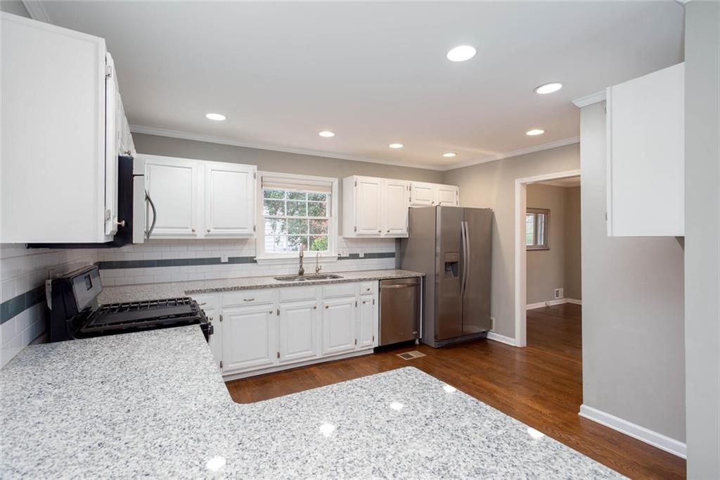 1066 Foreststone Way Marietta, GA 30064 - Photo 14 of 53 a kitchen with refrigerator and cabinets