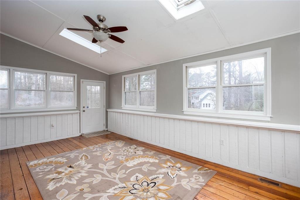 1066 Foreststone Way Marietta, GA 30064 - Photo 17 of 53 a view of an empty room with a window and wooden floor