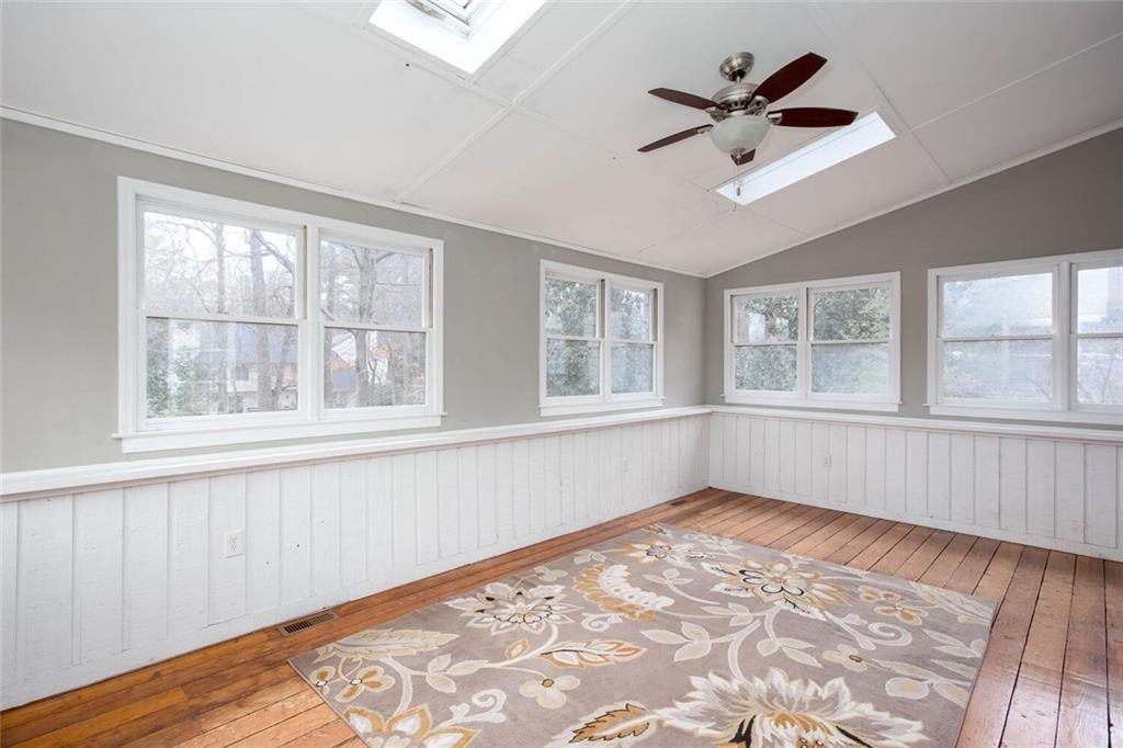 1066 Foreststone Way Marietta, GA 30064 - Photo 18 of 53 a view of empty room with wooden floor and fan
