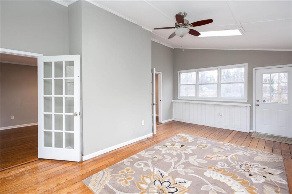 1066 Foreststone Way Marietta, GA 30064 - Photo 19 of 53 an empty room with windows and ceiling fan