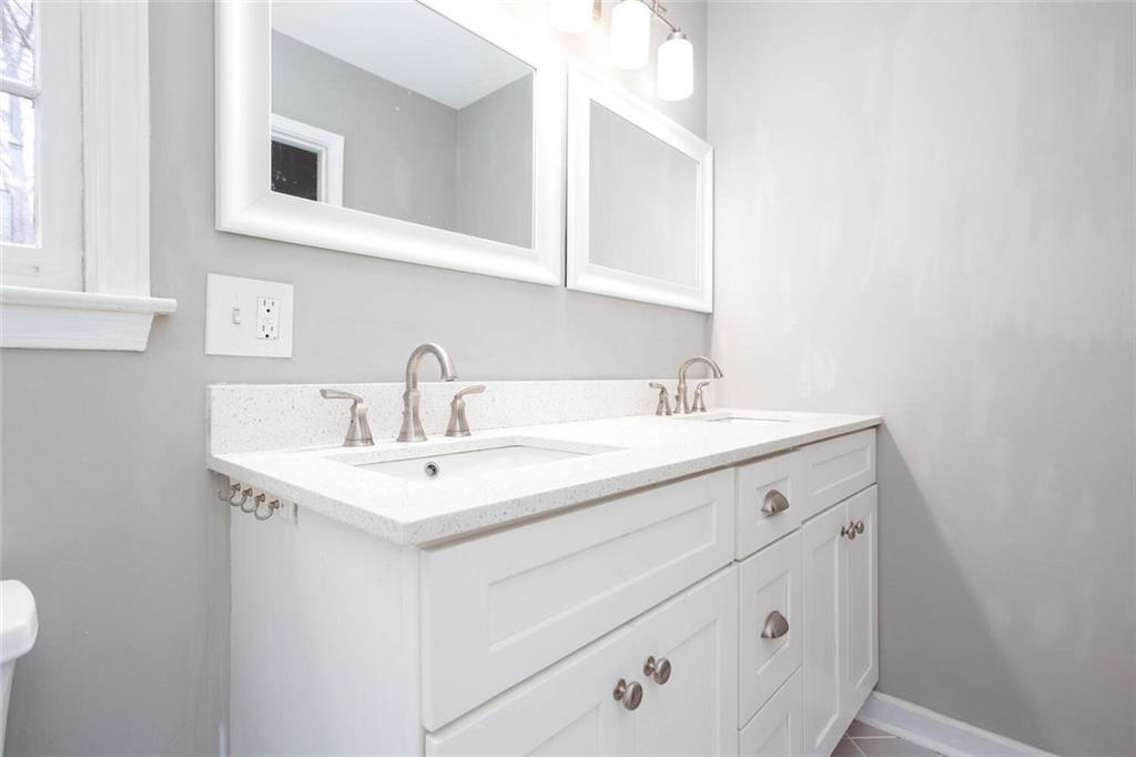 1066 Foreststone Way Marietta, GA 30064 - Photo 25 of 53 a bathroom with a sink and a mirror