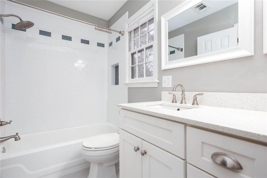 1066 Foreststone Way Marietta, GA 30064 - Photo 26 of 53 a bathroom with a sink a toilet and a bathtub