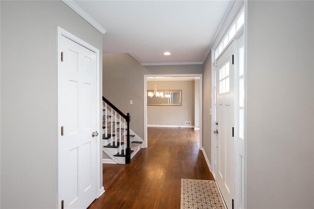 1066 Foreststone Way Marietta, GA 30064 - Photo 3 of 53 a view of a hallway with wooden floor and staircase