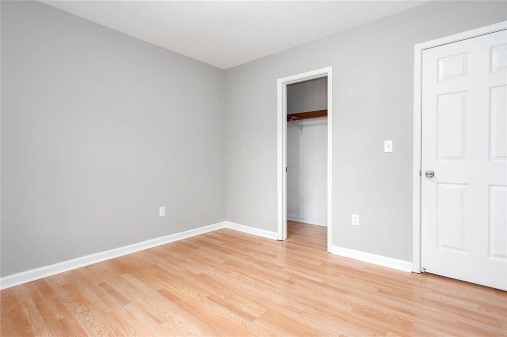 1066 Foreststone Way Marietta, GA 30064 - Photo 36 of 53 an empty room with wooden floor and closet
