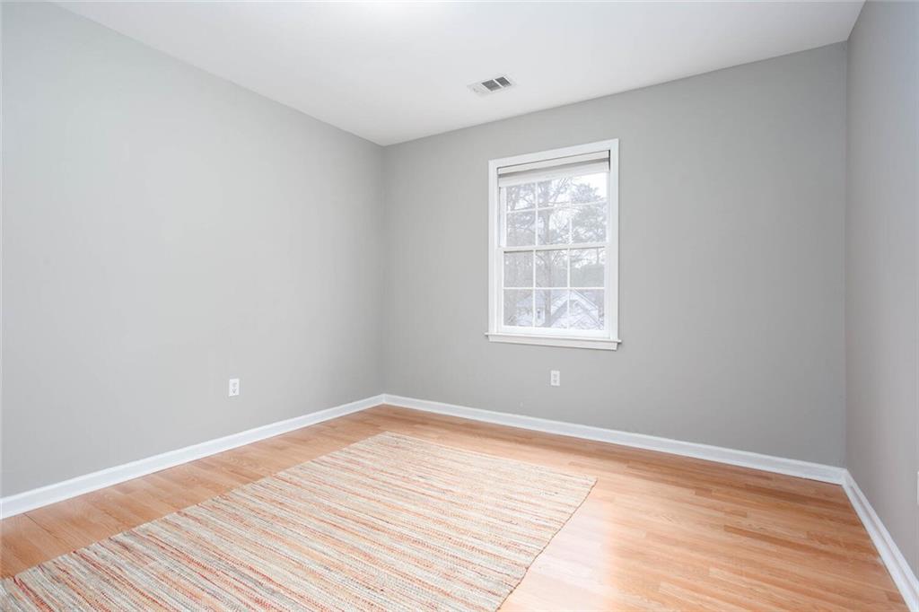 1066 Foreststone Way Marietta, GA 30064 - Photo 37 of 53 a view of a room with wooden floor and windows