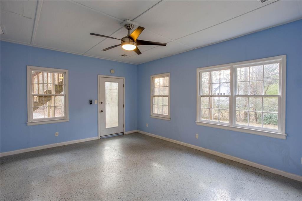 1066 Foreststone Way Marietta, GA 30064 - Photo 42 of 53 an empty room with windows and ceiling fan