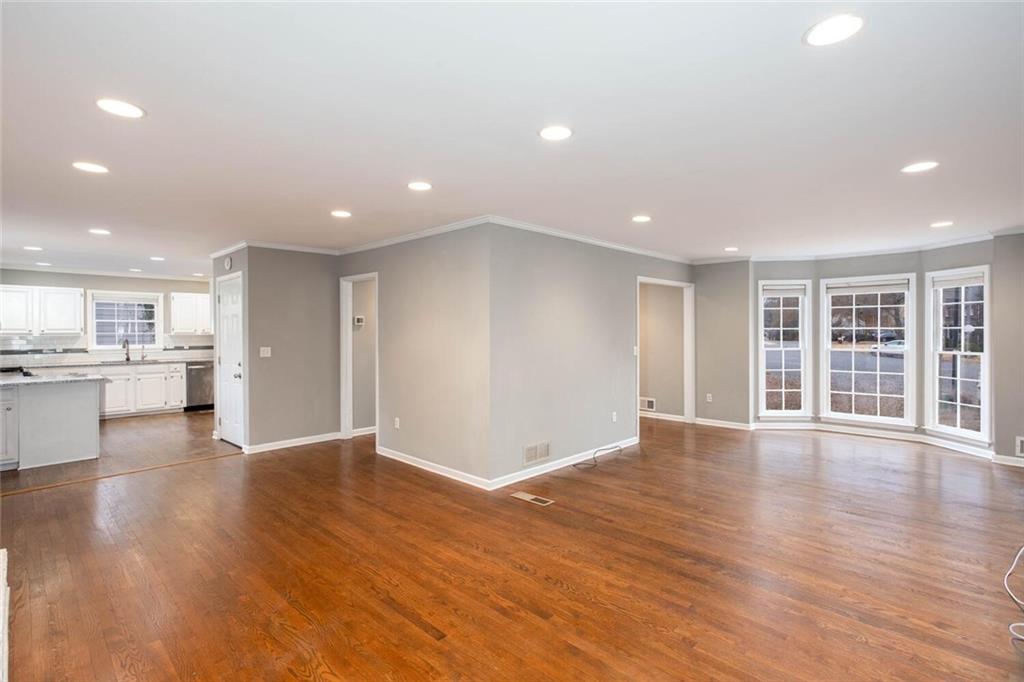 1066 Foreststone Way Marietta, GA 30064 - Photo 8 of 53 a view of an empty room with wooden floor and windows