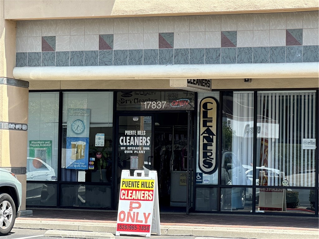 a front view of a building with parking area