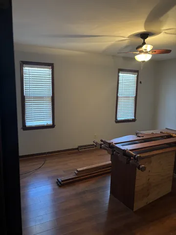 a room with furniture and wooden floor