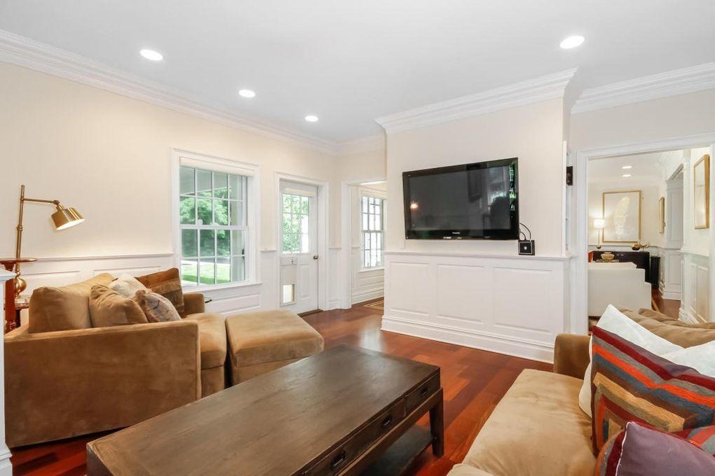 5 Clocks Lane Darien, CT 06820 - Photo 11 of 35 a living room with furniture and a flat screen tv