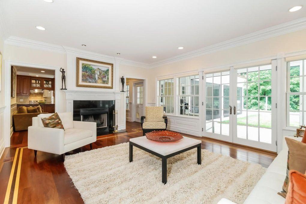 5 Clocks Lane Darien, CT 06820 - Photo 13 of 35 a living room with furniture and a fireplace