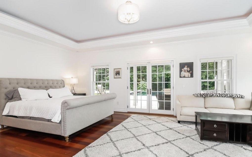 5 Clocks Lane Darien, CT 06820 - Photo 16 of 35 a bedroom with a bed and a window