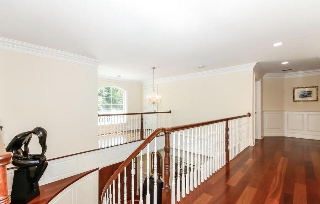 5 Clocks Lane Darien, CT 06820 - Photo 17 of 35 a view of a hallway with a window