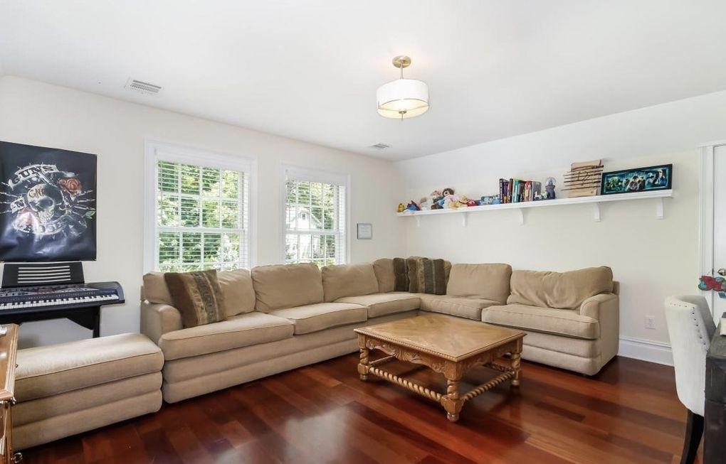 5 Clocks Lane Darien, CT 06820 - Photo 18 of 35 a living room with furniture and a large window