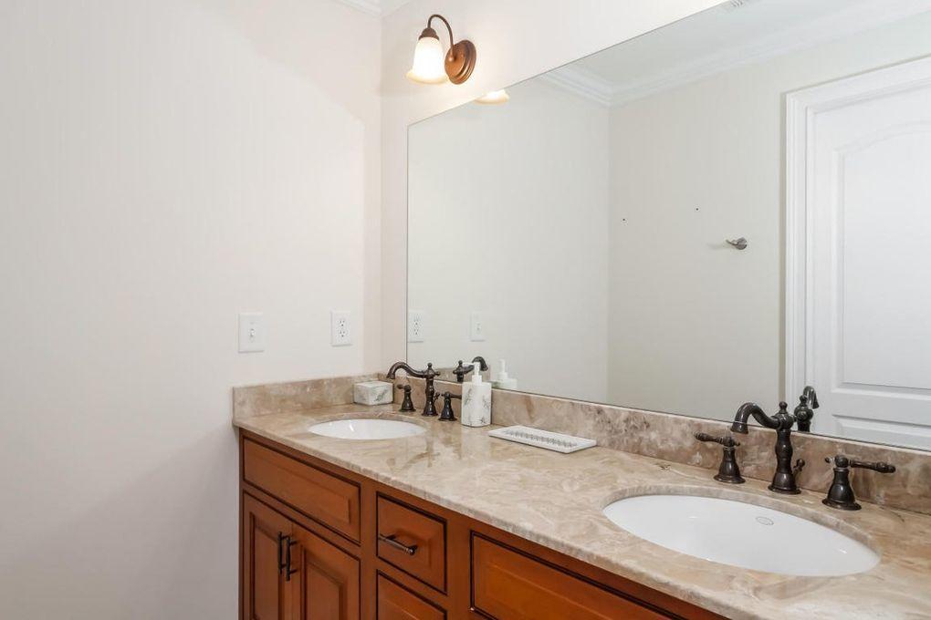 5 Clocks Lane Darien, CT 06820 - Photo 19 of 35 a bathroom with a sink and a mirror