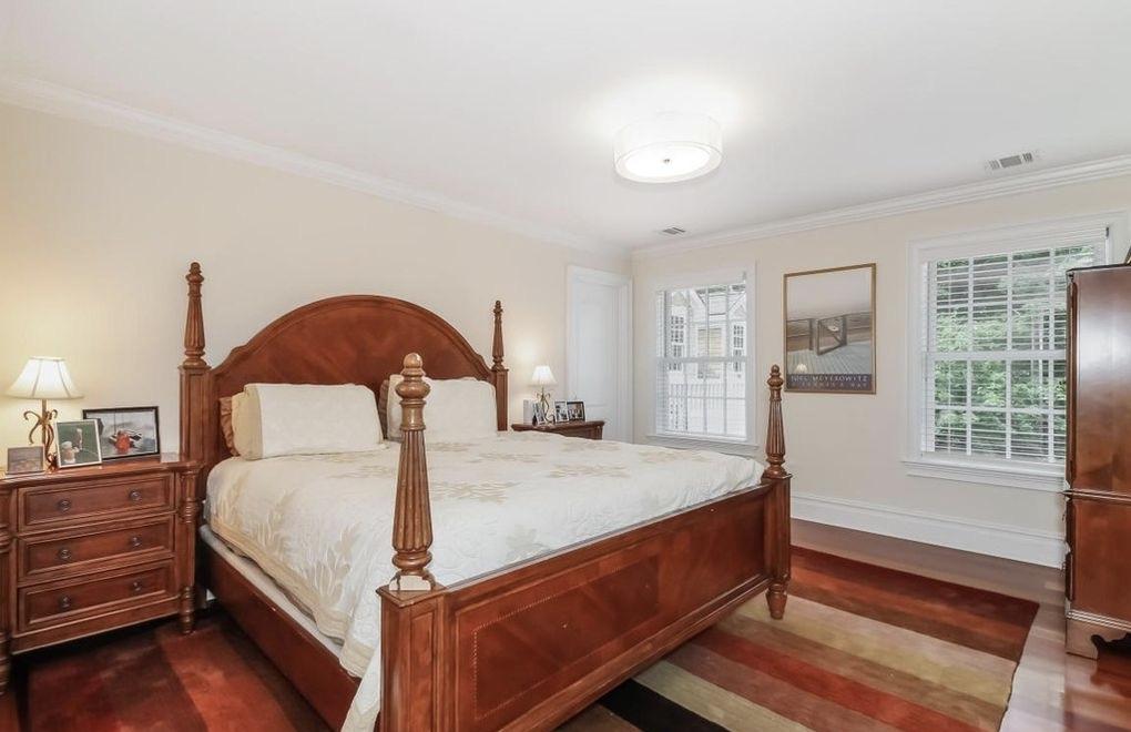 5 Clocks Lane Darien, CT 06820 - Photo 20 of 35 a bed sitting in a spacious bedroom next to a window