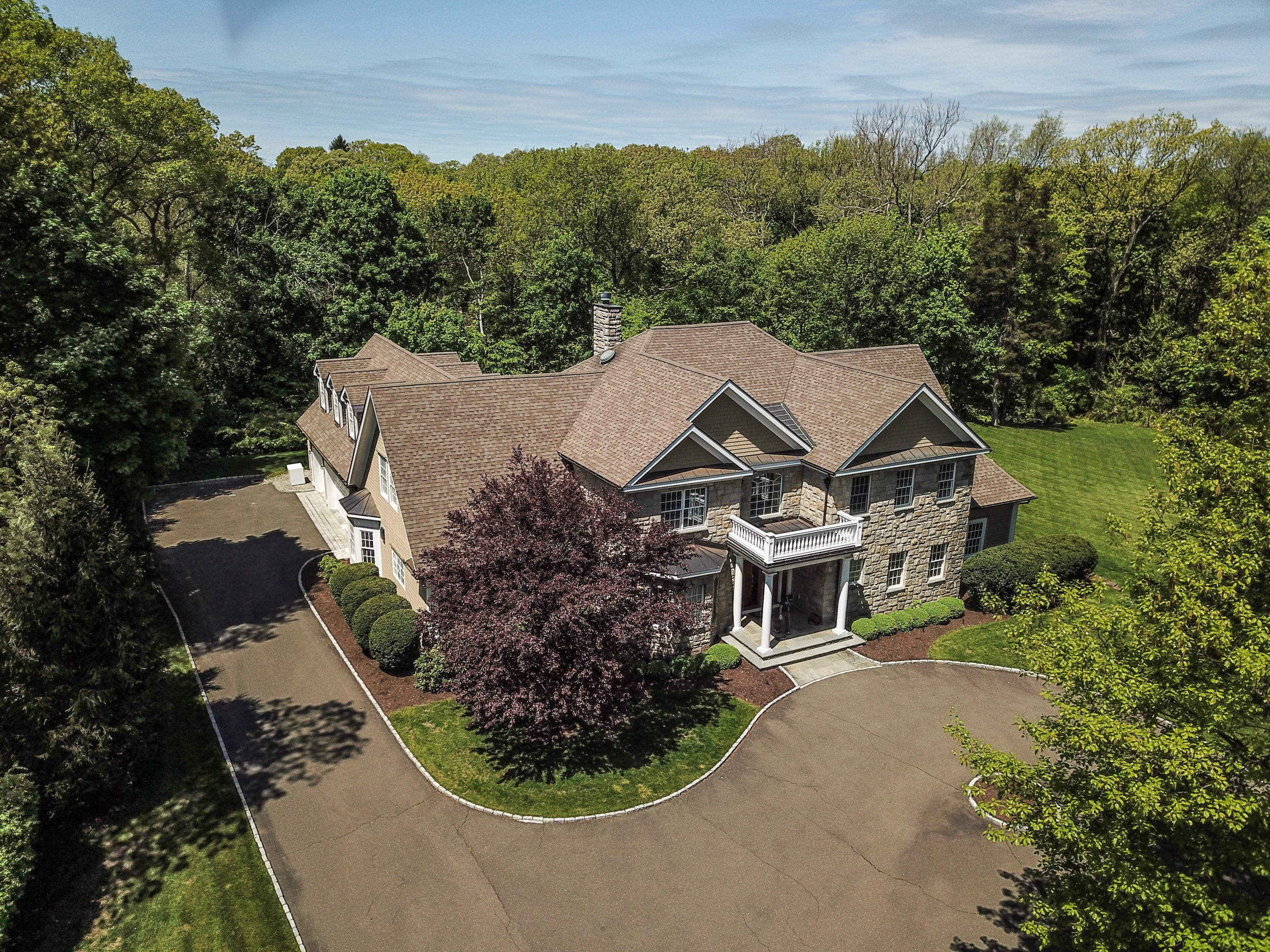 5 Clocks Lane Darien, CT 06820 - Photo 2 of 35 an aerial view of a house with a garden