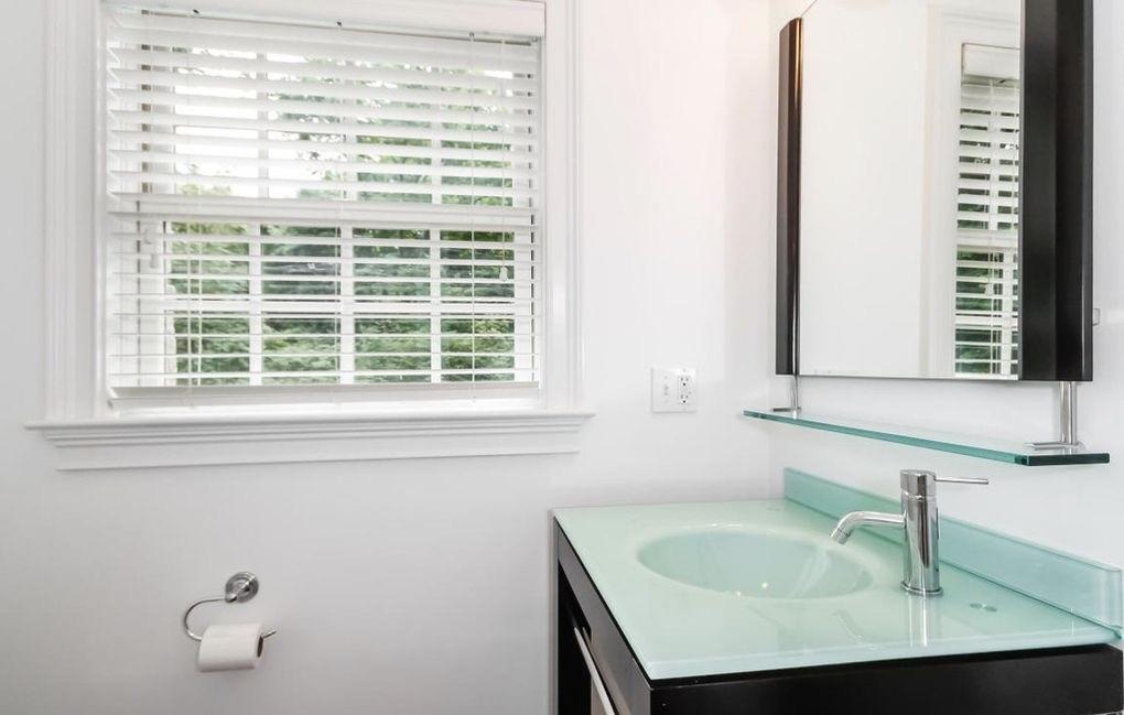 5 Clocks Lane Darien, CT 06820 - Photo 21 of 35 a bathroom with a sink and a window