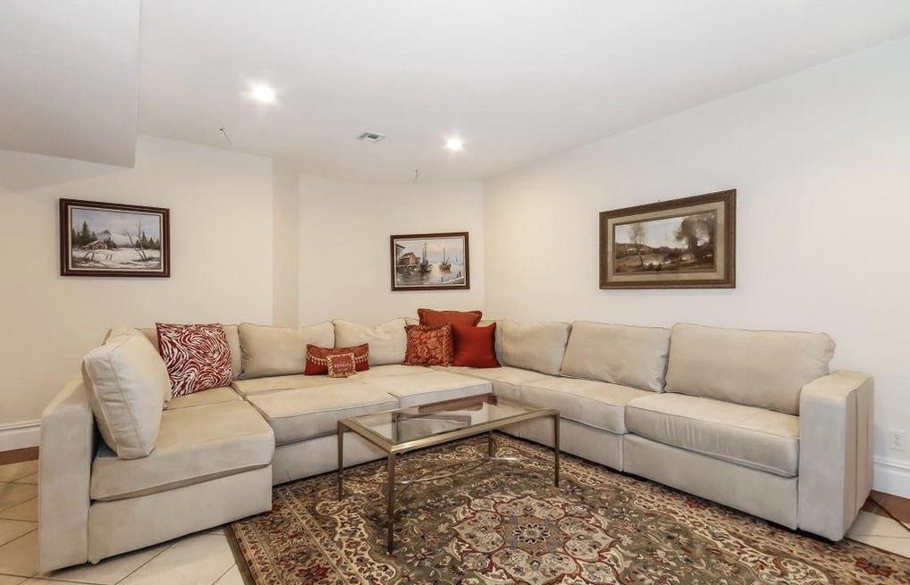 5 Clocks Lane Darien, CT 06820 - Photo 23 of 35 a living room with furniture and a couch