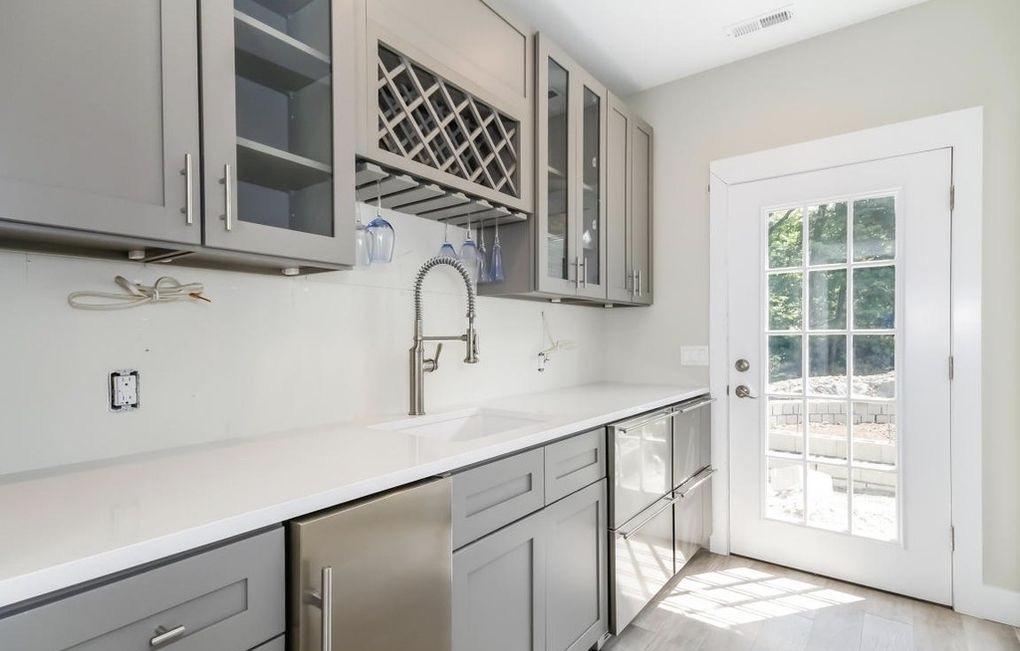 5 Clocks Lane Darien, CT 06820 - Photo 27 of 35 a kitchen with a sink and cabinets