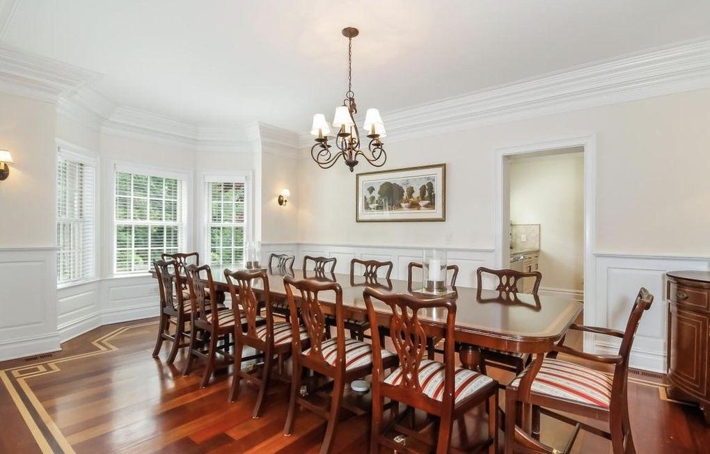5 Clocks Lane Darien, CT 06820 - Photo 5 of 35 a view of a dining room with furniture wooden floor and chandelier