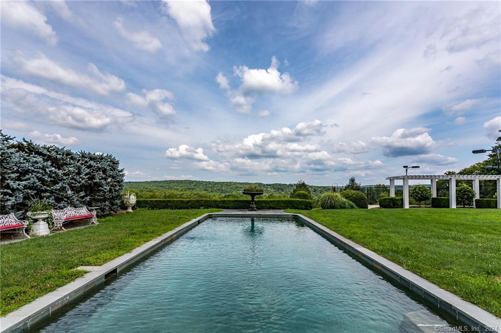 a view of a garden with lawn chairs