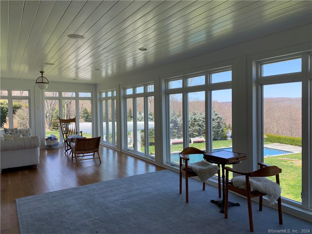 28 Leavenworth Road Woodbury, CT 06798 - Photo 13 of 37 a living room with furniture and a large window