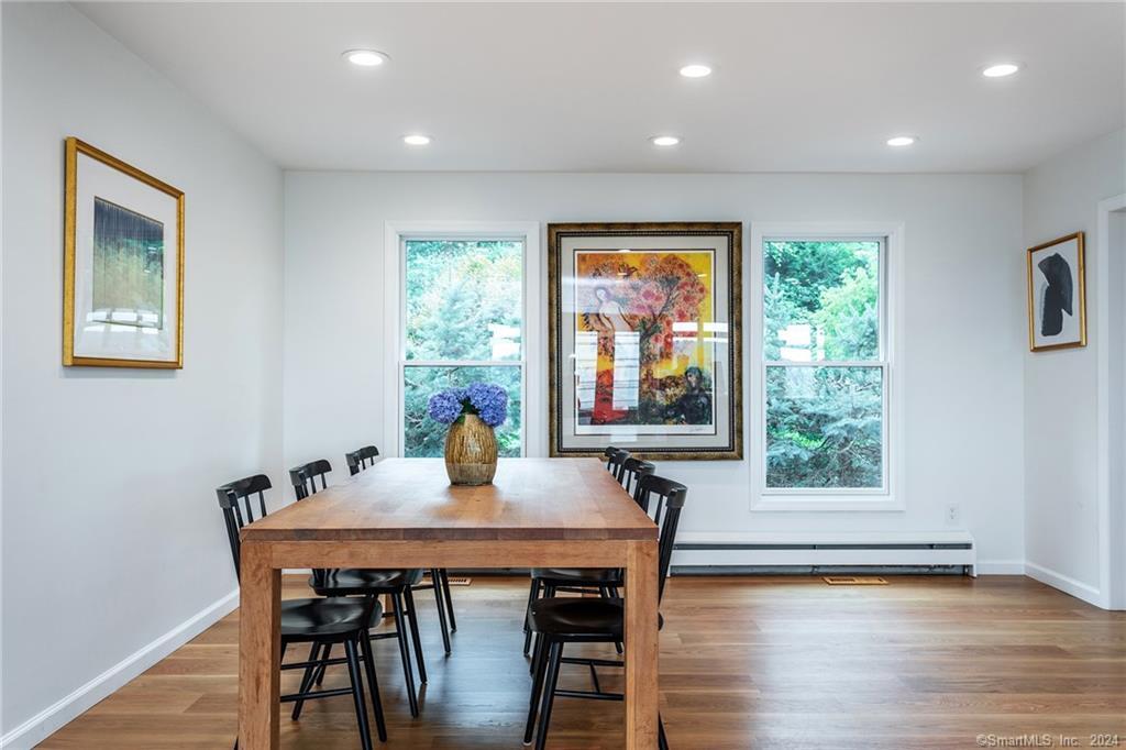 28 Leavenworth Road Woodbury, CT 06798 - Photo 16 of 37 a dining room with furniture and wooden floor