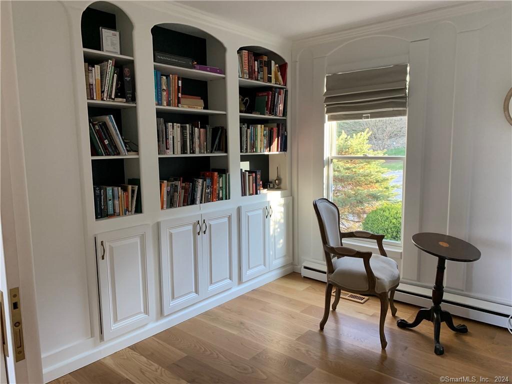 28 Leavenworth Road Woodbury, CT 06798 - Photo 19 of 37 a view of a workspace with furniture and a bookshelf