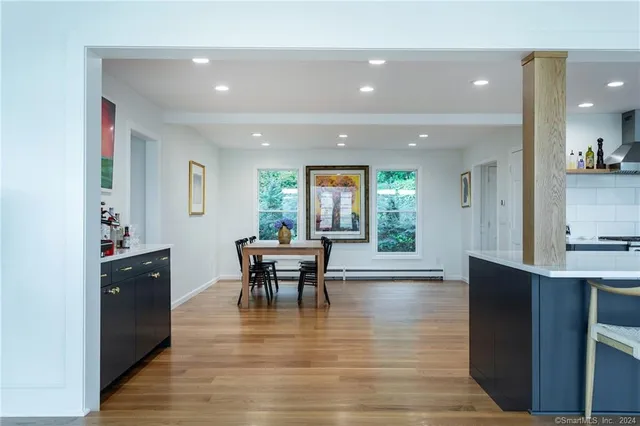 a view of a dining room with furniture window and wooden floor