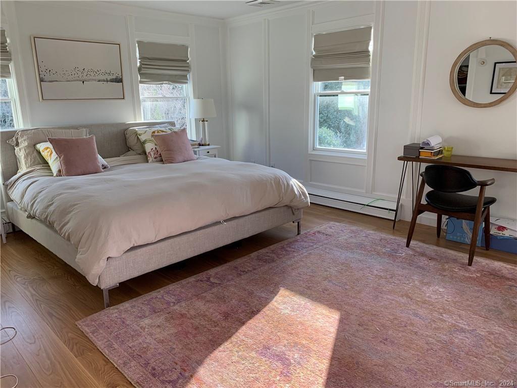 28 Leavenworth Road Woodbury, CT 06798 - Photo 23 of 37 a bedroom with a bed a table and chair