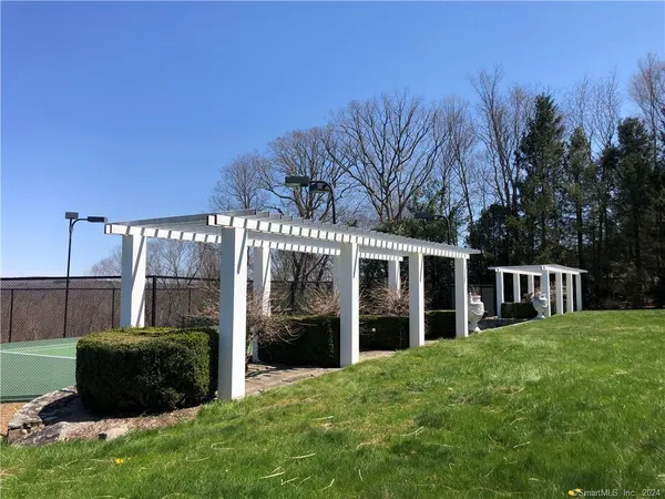 a view of a house with backyard and porch