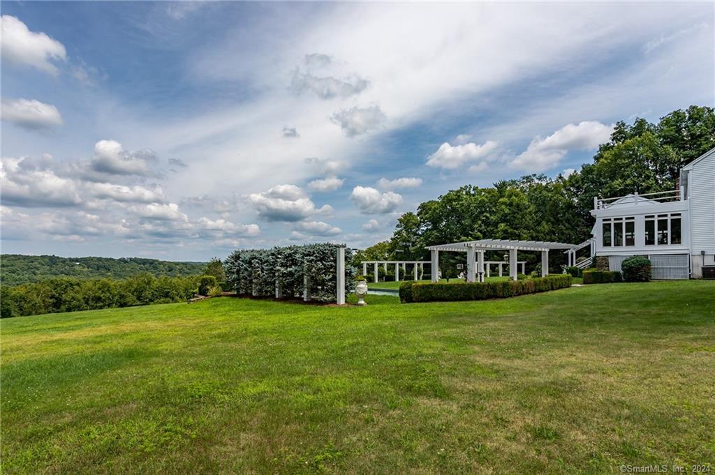 28 Leavenworth Road Woodbury, CT 06798 - Photo 31 of 37 a view of a house with a big yard and a large trees