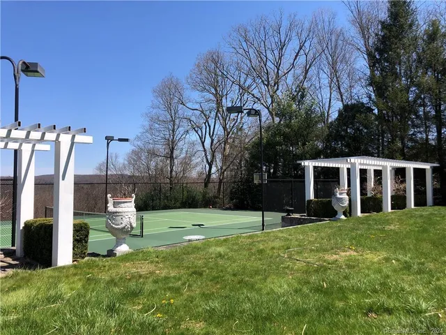 a view of a house with backyard and porch