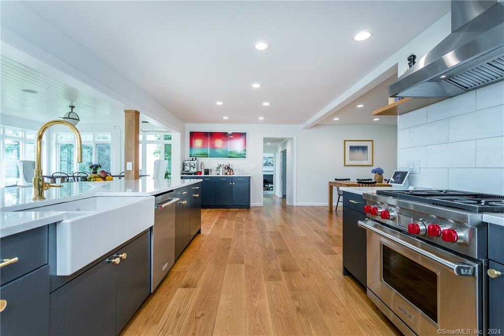 28 Leavenworth Road Woodbury, CT 06798 - Photo 5 of 37 a kitchen with stainless steel appliances granite countertop a stove and a wooden floors