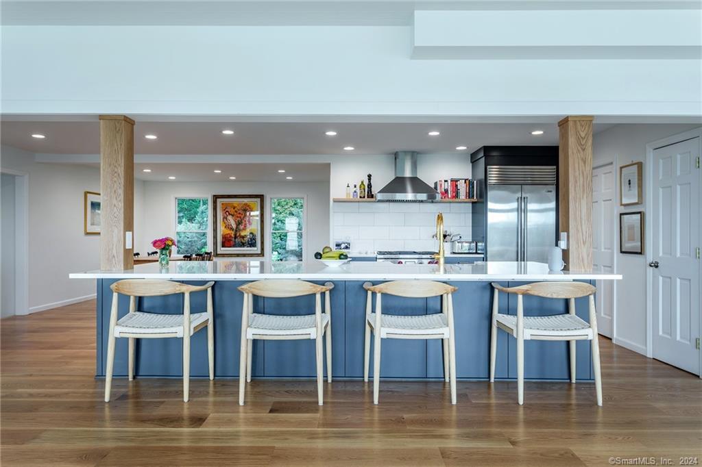 28 Leavenworth Road Woodbury, CT 06798 - Photo 6 of 37 a kitchen with a dining table chairs and wooden floor