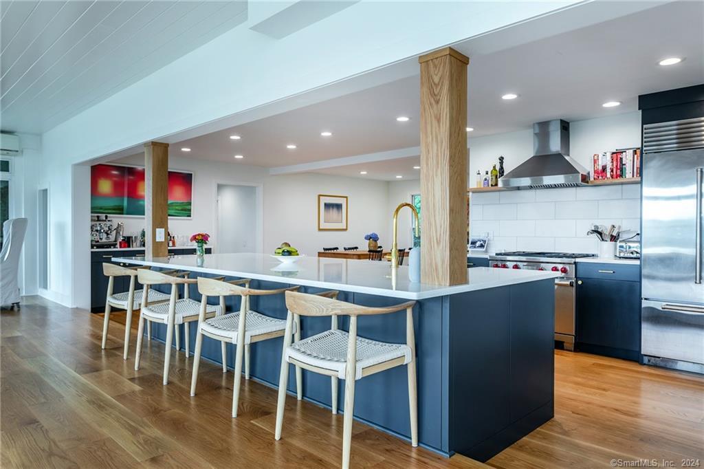 28 Leavenworth Road Woodbury, CT 06798 - Photo 7 of 37 a kitchen with stainless steel appliances granite countertop a table chairs sink and cabinets