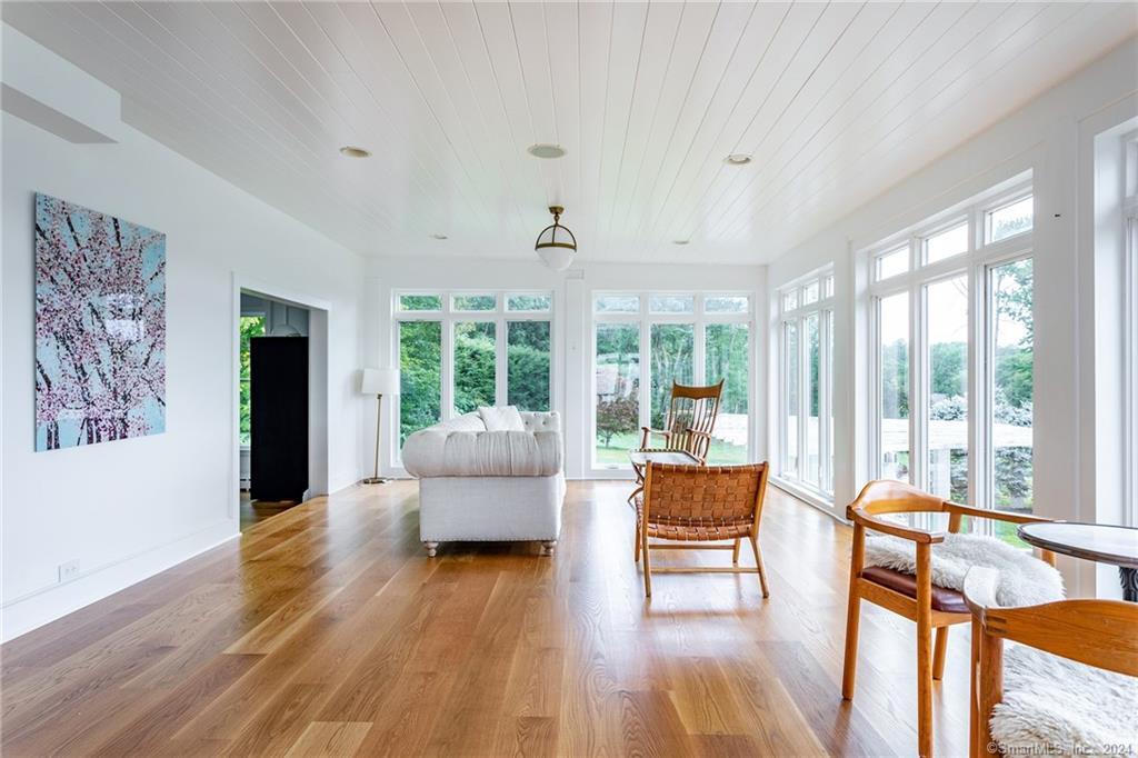 28 Leavenworth Road Woodbury, CT 06798 - Photo 8 of 37 a living room with furniture and a large window