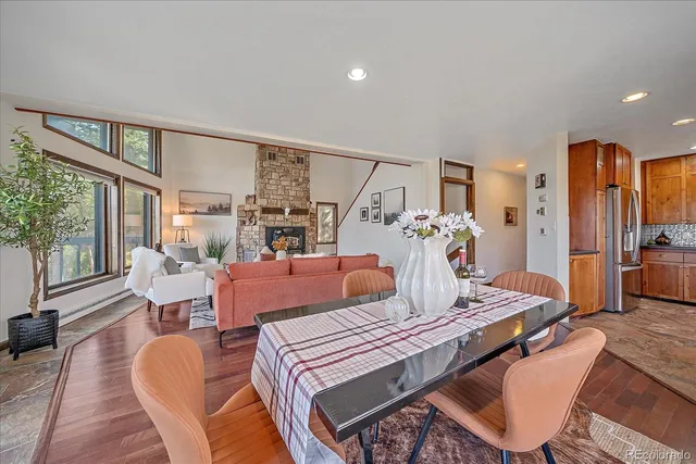 a bedroom with furniture and a large window