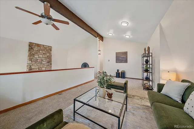 a bedroom with a bed and a potted plant