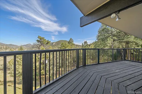 a view of a city with lush green forest