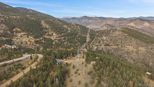 a view of a city with mountains in the background