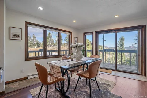 a dining room with furniture window wooden floor