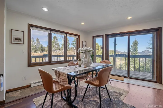 a dining room with furniture window wooden floor