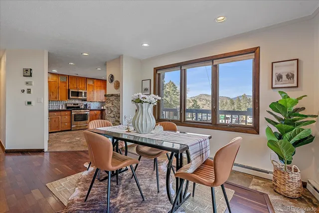 a view of a dining room with furniture window and wooden floor
